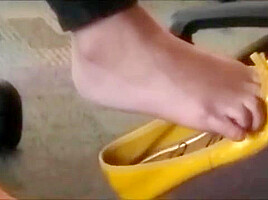 Hot shoeplay in yellow flats in computer lab