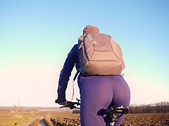 In Yoga Pants Riding A Bicycle And Teasing