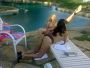 Lesbo in act by the pool