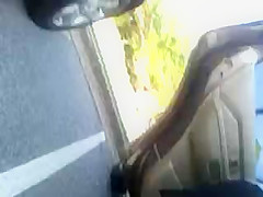MILF upskirted in a parking lot