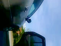 MILF upskirted in a parking lot