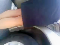 MILF upskirted in a parking lot