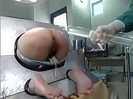 Milf Bound In A Machine And Takes An Enema In Her Ass