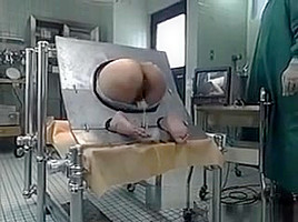 Milf Bound In A Machine And Takes An Enema In Her Ass