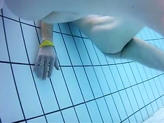 Nudist camp swimming pool has lots of lovely women