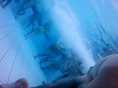 Nudist camp swimming pool has lots of lovely women