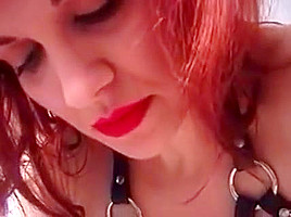 Red head in white leather gets her ass spanked