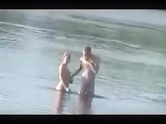 Russian couple on a wild beach