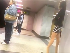 Sexy legs upskirted in subway