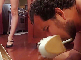 Slave cleans shoes for Princess