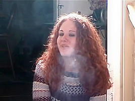Smoking girl with lovely curly red hair