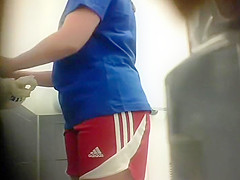 Sporty girl spied bending over to pee