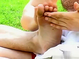 Sporty homos feet oiled up and tickled by his friends