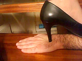 Stiletto Pumps Tramples hand closeup