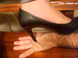 Stiletto Pumps Tramples hand closeup