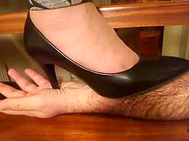 Stiletto Pumps Tramples hand closeup