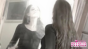 Stockinged lesbian nina strips off slowly