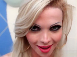 Stockinged shemale tugging cock in lingerie