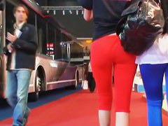 Street candid video with sexy blonde in red pants