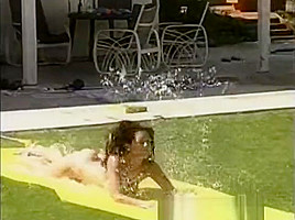 Tawnee Stone sliding fun in the garden with friends