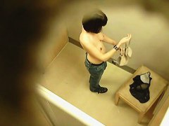 Topless tattooed asian babe caught by changing room