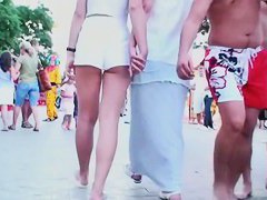 Two lesbian babes are walking around in white shorts