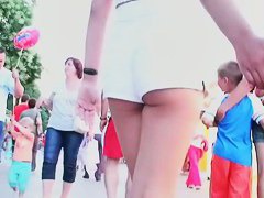 Two lesbian babes are walking around in white shorts