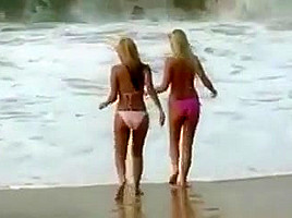 Two lesbians puts on a show for the boys on a beach!