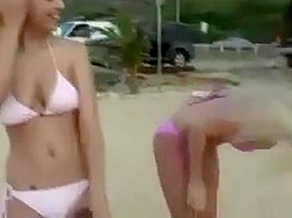 Two lesbians puts on a show for the boys on a beach!