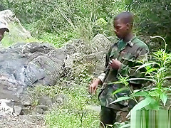 Two military lads resting by the river