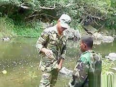 Two military lads resting by the river