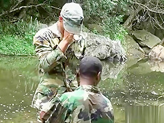 Two military lads resting by the river