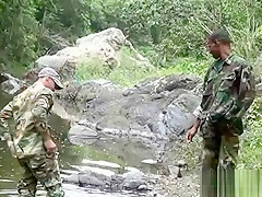 Two military lads resting by the river