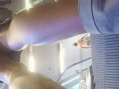 Upskirt of a beauty in jeans miniskirt