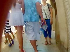 Upskirt of a girl holding hands with a guy