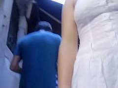 Upskirt of a girl holding hands with a guy