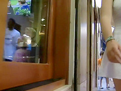 Upskirt of a girl holding hands with a guy