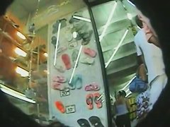 Upskirt shoe shopping brunette in a black dress and big round ass porno