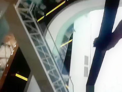 Upskirted in the shopping mall rolling stairs