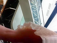 Upskirted in the shopping mall rolling stairs