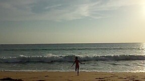 Vera is naked on the beach
