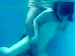 White Asics swimsuit underwater play