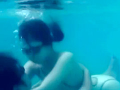 White Asics swimsuit underwater play