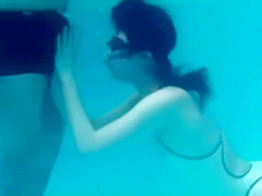 White Asics swimsuit underwater play