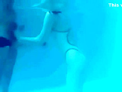 White Asics swimsuit underwater play