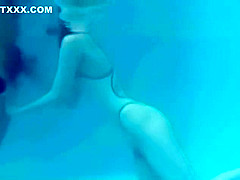 White Asics swimsuit underwater play