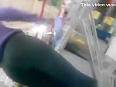 Woman in black leggings in supermarket