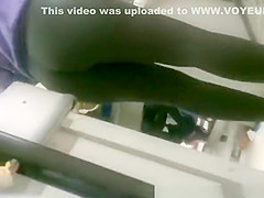 Woman in black leggings in supermarket