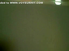 Woman in red jacket pissing