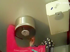 Woman in red jacket pissing